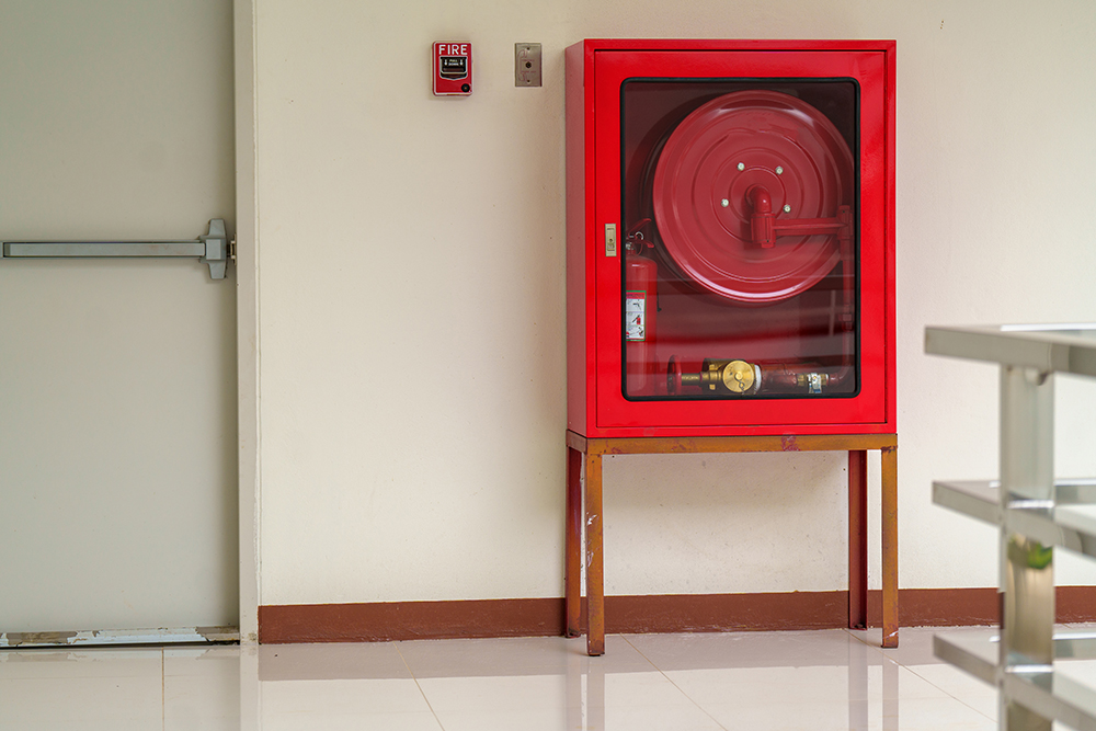 fire extinguisher system on the wall background, powerful emergency equipment for industrial